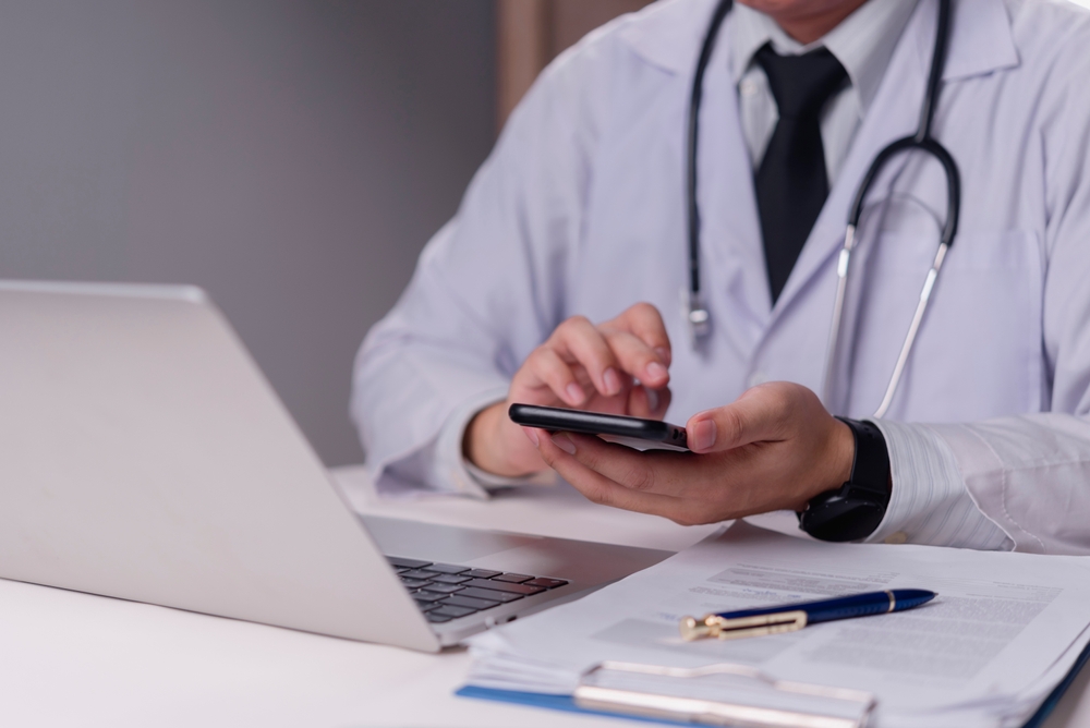 doctor,using,smartphone,,medical,professional,,telemedicine,,online,consultation,,healthcare,communication,